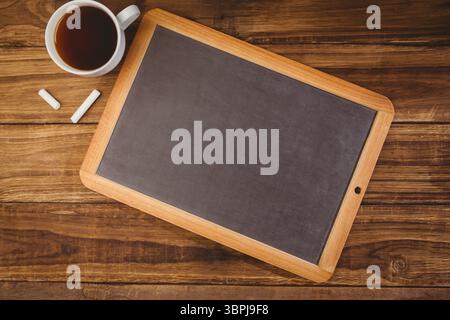 Composite image of chalkboard with coffee mug Stock Photo