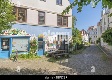 Residential street in the Ostertor neighbourhood a popular residential area, eastern suburb, Wilhelminian style building, traffic-calmed, graffiti, sq Stock Photo