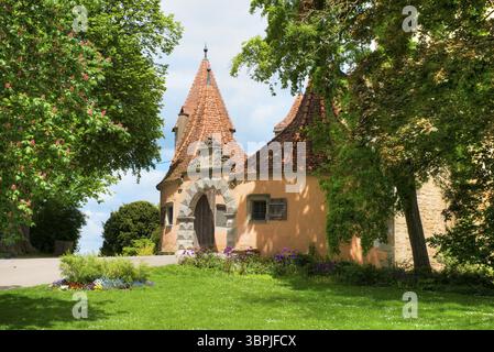 Entrance to the castle gate seen from the castle garden in Rothenburg ob der Tauber, Middle Franconia in nice weather, Rothenburg ob der Tauber, Germa Stock Photo