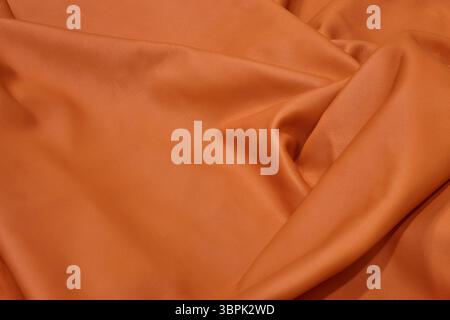 Surface natural piece of leather in orange color. Textured background Stock Photo