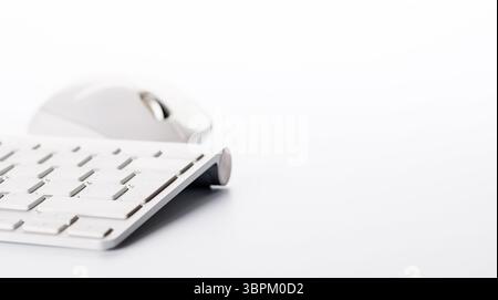 Keyboard and mouse on a white background with ample copy space for text or design elements Stock Photo