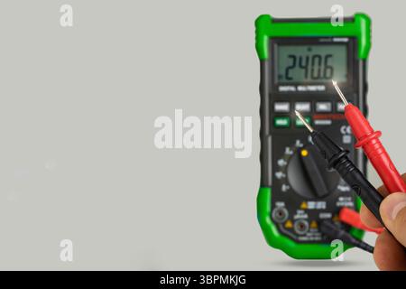 Digital Multimeter with Red and Black Probes Stock Photo