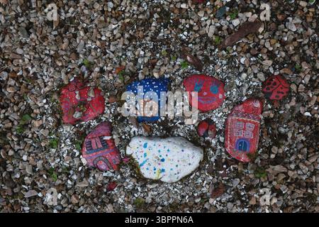 Funky, fun painted pebbles Stock Photo