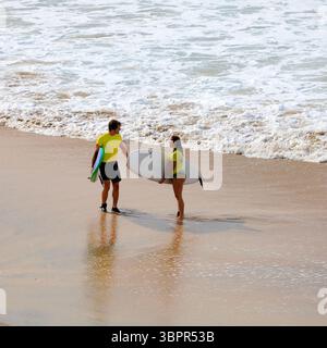 Man and woman seemingly having an argument or heated discussion on the shoreline, Fuerteventura, Canary Islands, Spain, Europe, EU Stock Photo