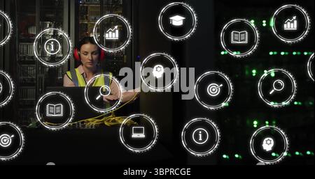 In school, image of technician working on server with digital technology icons Stock Photo