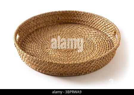 Wicker woven bamboo tray isolated on white background. Handmade by local craftsmen in sri lanka traditional tableware. Close up. Stock Photo