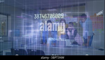 Collaborating over digital image, diverse team in modern office environment Stock Photo