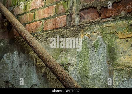 Detail of texture brick wall staircase with railing in abandoned house Indiana USA Stock Photo