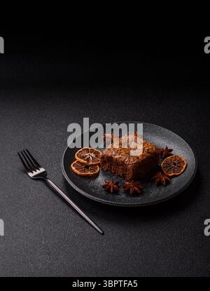 Chocolate brownie cake, food, sweet dessert with nuts rectangular shape. A slice of sweet chocolate brownie for the dinner table Stock Photo