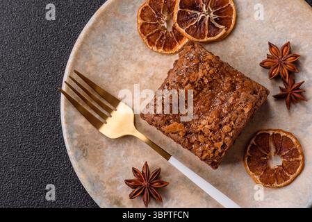 Chocolate brownie cake, food, sweet dessert with nuts rectangular shape. A slice of sweet chocolate brownie for the dinner table Stock Photo