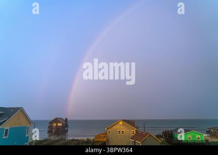 Rainbow Out Over the Ocean in the Outer Banks With Beach Homes North Carolina Stock Photo