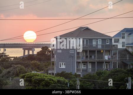 The Sun Setting Behind the Jug Handle Bridge in Rodanthe North Carolina Outer Banks Stock Photo
