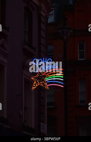 Multi-coloured neon Christmas sign in Soho, London, England, UK. Stock Photo