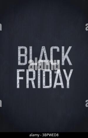 Displaying BLACK FRIDAY text in chalk-style lettering on dark charcoal textured chalkboard backdrop Stock Photo