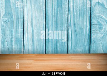 Displaying wooden tabletop before vertical light turquoise painted plank wall, flat design Stock Photo