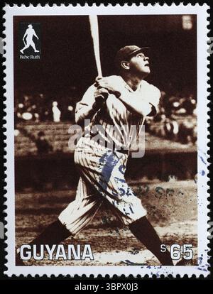 Babe Ruth in action during a match on stamp of Guyana Stock Photo