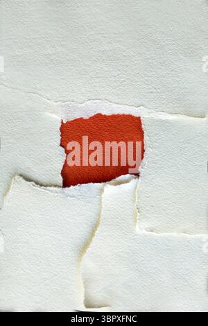 Torn tectured red and white paper background with copy space Stock Photo