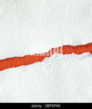 Torn textured red and white paper background with copy space Stock Photo