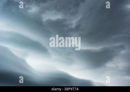 Gray Nimbostratus clouds against sky Stock Photo