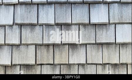 natural old woodenwall with many small wooden slats in grey color tones Stock Photo