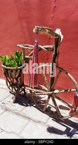 Very old decorative bicycle adorned with natural flowers Stock Photo