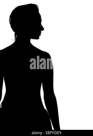 A silhouette of a person, likely a woman, is seen from the back and side profile. The person's hair is pulled back, and the image is set against a bri Stock Photo