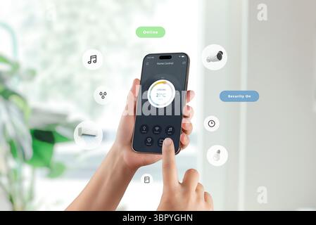 Smart home app with cooling control and security status displayed on mobile screen in natural setting Stock Photo