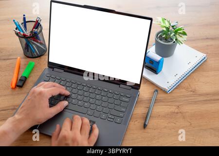 Man using laptop with blank screen, copy space Stock Photo
