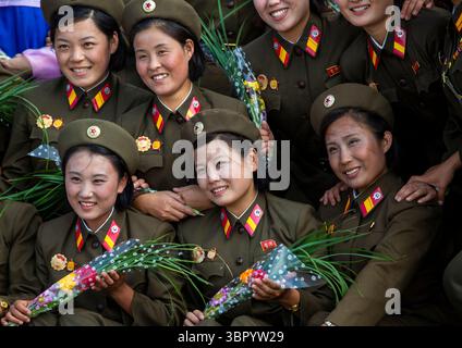 North Korean soldiers women smiling while posing for a photo, DGC, Pyongyang, North Korea Stock