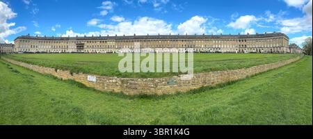 wide angle Panoramic view of the historic Royal Crescent in Bath, England with blue sky and clouds Stock Photo