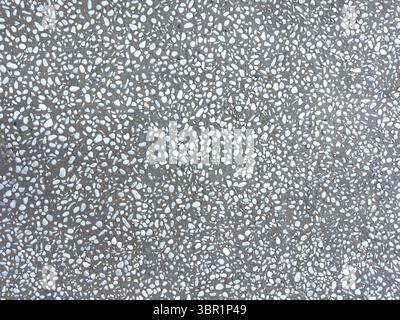 Natural stones mosaic background texture. River pebbles and concrete, gray color floor pattern Stock Photo