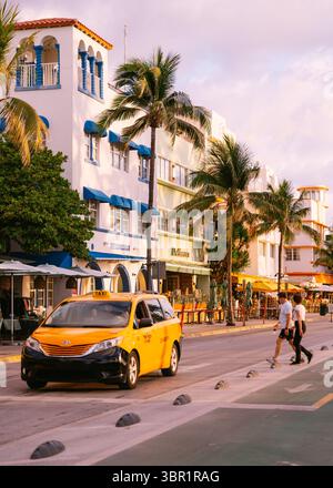 Yellow cab on Ocean drive in Miami Beach Florida Stock Photo