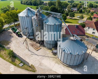 4  large silos are located on a farm Stock Photo