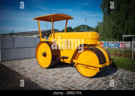 An old yellow historic levelling roller Stock Photo
