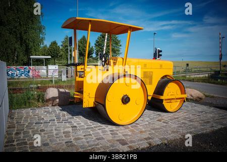 An old yellow historic levelling roller Stock Photo