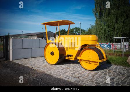 An old yellow historic levelling roller Stock Photo