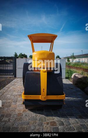An old yellow historic levelling roller Stock Photo