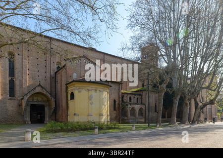 Side view of the Church of the Eremitani, Padua, Italy, showcasing the rear architecture with a circular structure and trees. Stock Photo