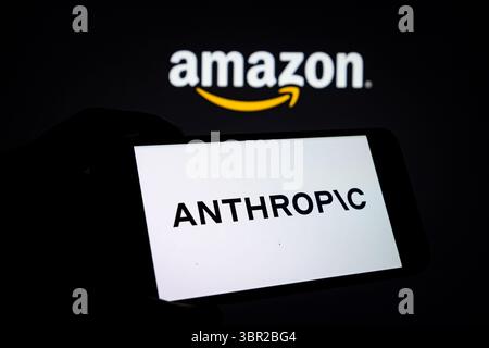 CHONGQING, CHINA - JULY 10, 2025 - An Anthropic logo displayed on a smartphone with AMAZON logo as the background in Chongqing, China on July 10, 2025. Stock Photo