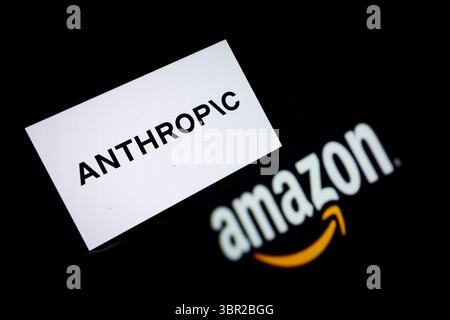 CHONGQING, CHINA - JULY 10, 2025 - An Anthropic logo displayed on a smartphone with AMAZON logo as the background in Chongqing, China on July 10, 2025. Stock Photo