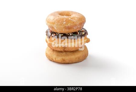 tower of assorted donuts isolated on white background Stock Photo