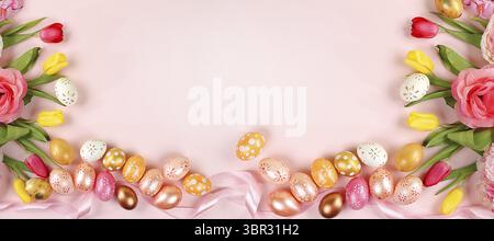 Festive easter banner, spring composition with decorated homemade eggs and blooming flowers, creative concept of easter, ideas for home decorations, t Stock Photo