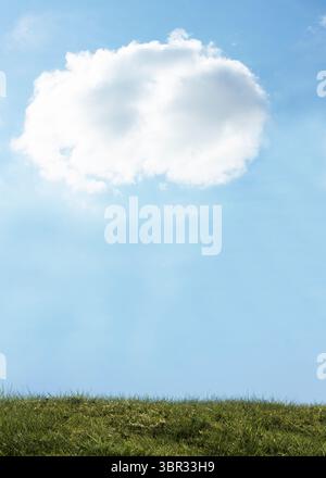 Single large fluffy white cloud is hovering above gently sloping green grass field in flat design Stock Photo