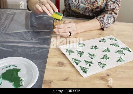 Process of printing with wooden stamps. workshop Stock Photo