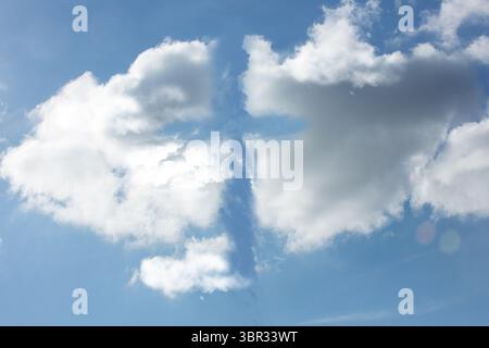 Pair of large cumulus clouds are drifting in flat vector illustration, featuring lens flare disc Stock Photo