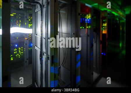Flat design illustration is showing data center corridor, rack door open, blinking LEDs and cables Stock Photo