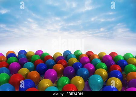 Many colourful balloons against sky Stock Photo