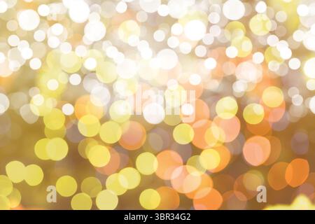 Bokeh light circles are creating glowing abstract background in flat design, blending warm tones Stock Photo