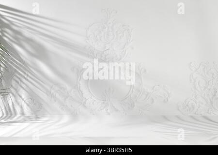 Premium empty podium with tropical palm leaves shadows on elegant grey wall, minimal abstract background for cosmetics product presentation, design te Stock Photo