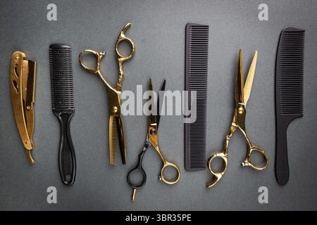 Various hair dresser and cut tools on black background with copy space Stock Photo